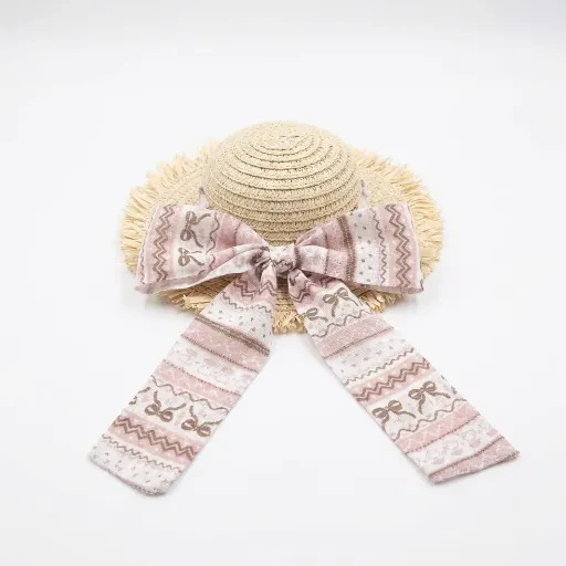 Pale hat with a pink patterned ribbon