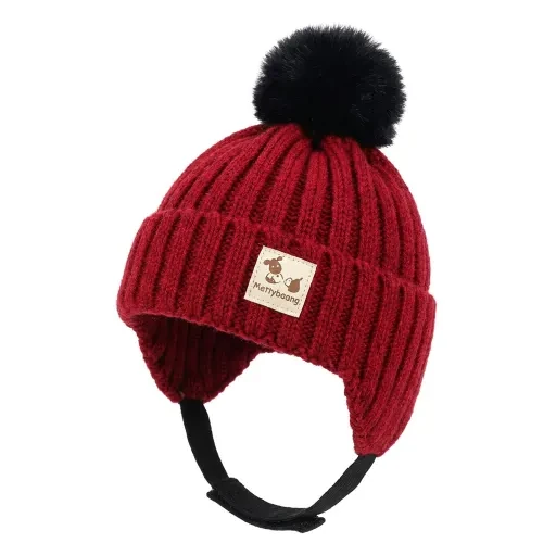Red knit-style hat with a black pom-pom